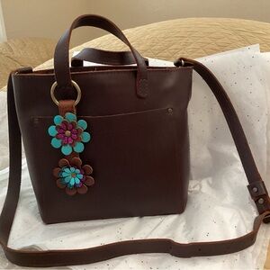 Chic Brown Crossbody Bag with Floral Accent
